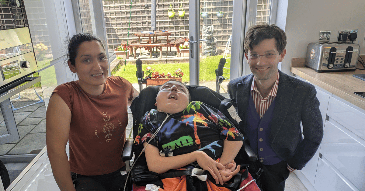 Dr. Sarah Fortais and Cameron from UCL smiling with Joseph Kendrick in the centre.