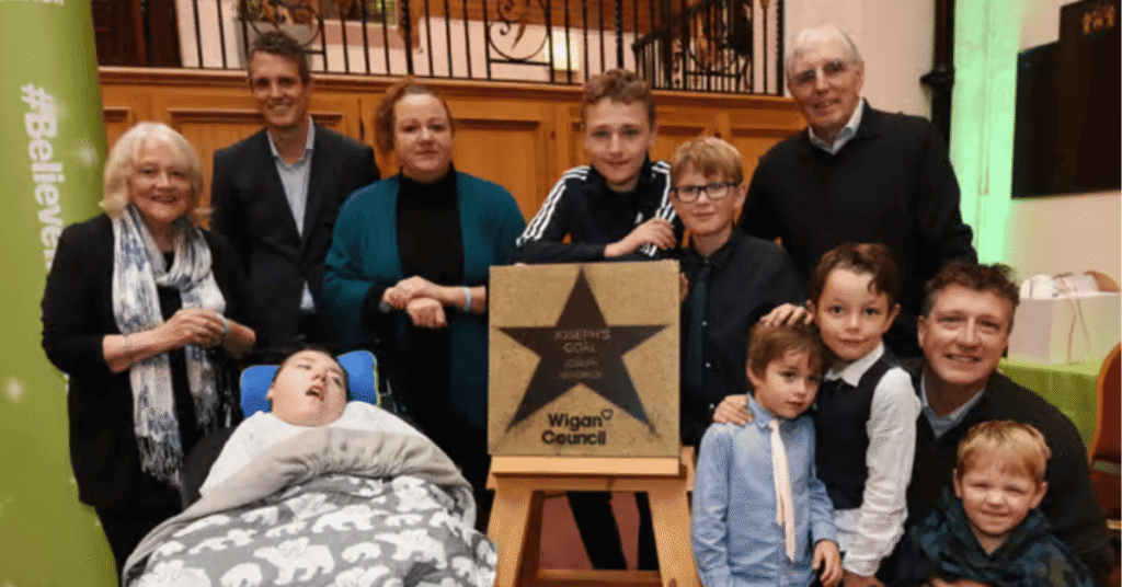 The Kendrick Family of Joseph's Goal receiving the Believe Star from Wigan Council