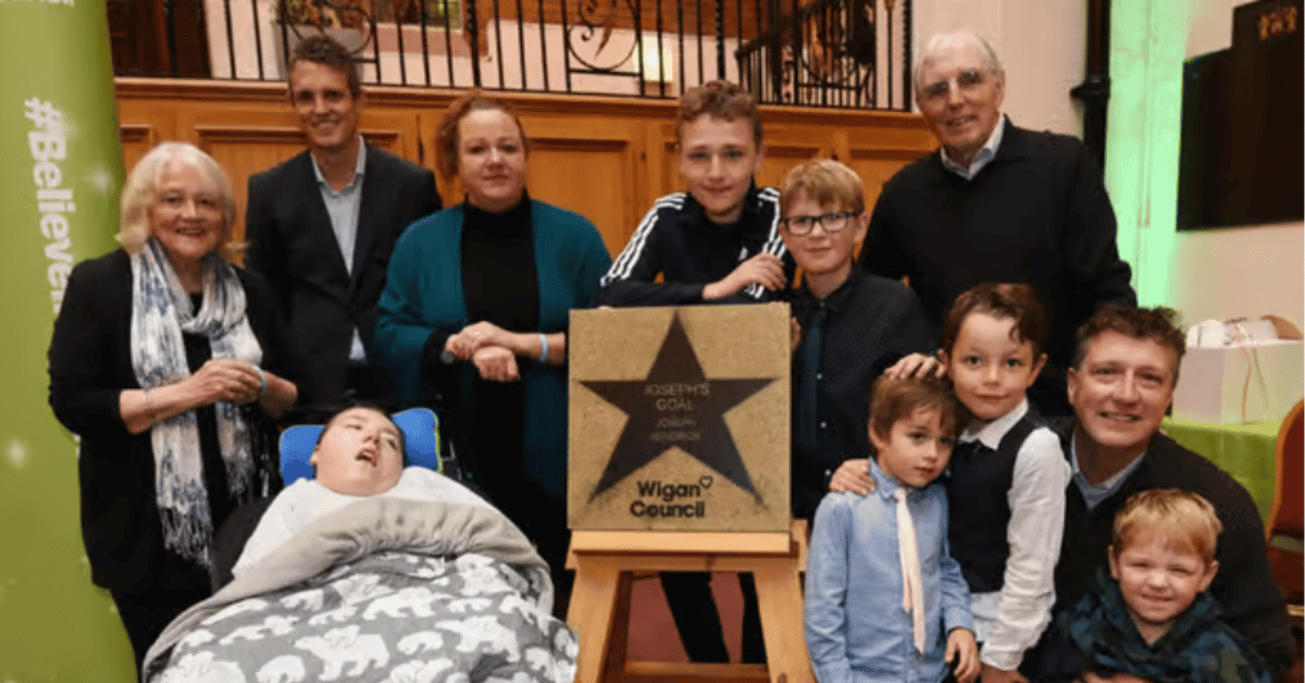 The Kendrick Family of Joseph's Goal receiving the Believe Star from Wigan Council